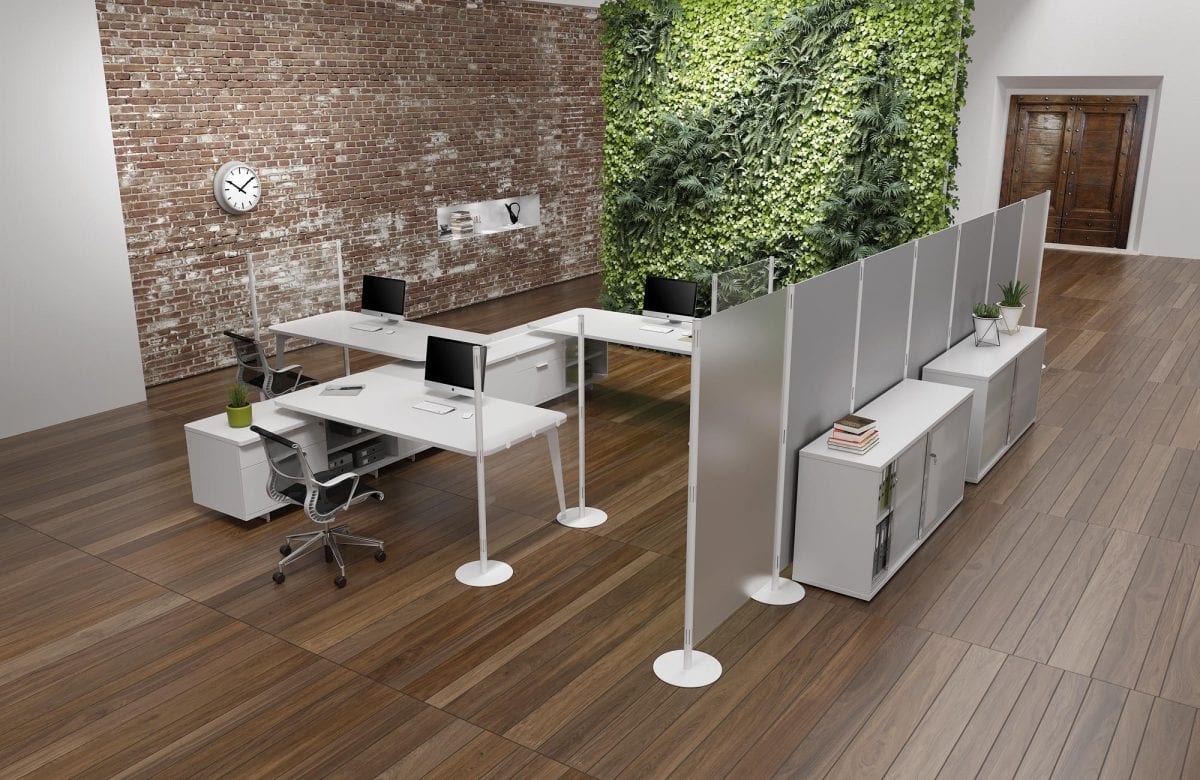 Open office with desks separated by screens