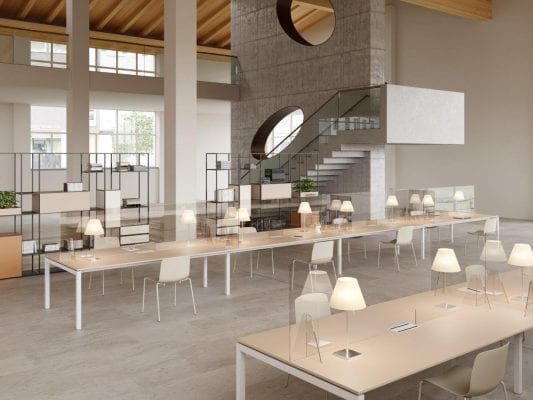 Open plan workspace with grey staircase