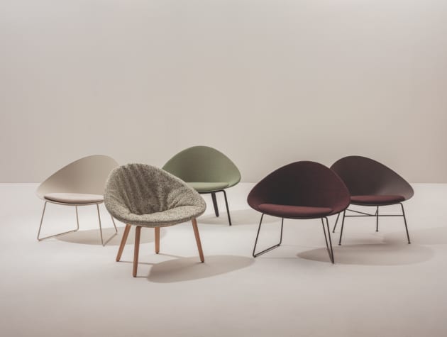 five modern chairs in various colours