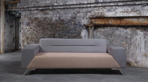 grey and pink sofa in industrial setting