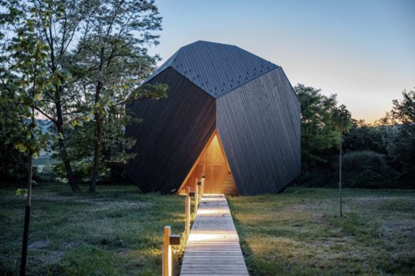 Hello Wood creates a collection of boulder-like cabins in the Hungarian countryside