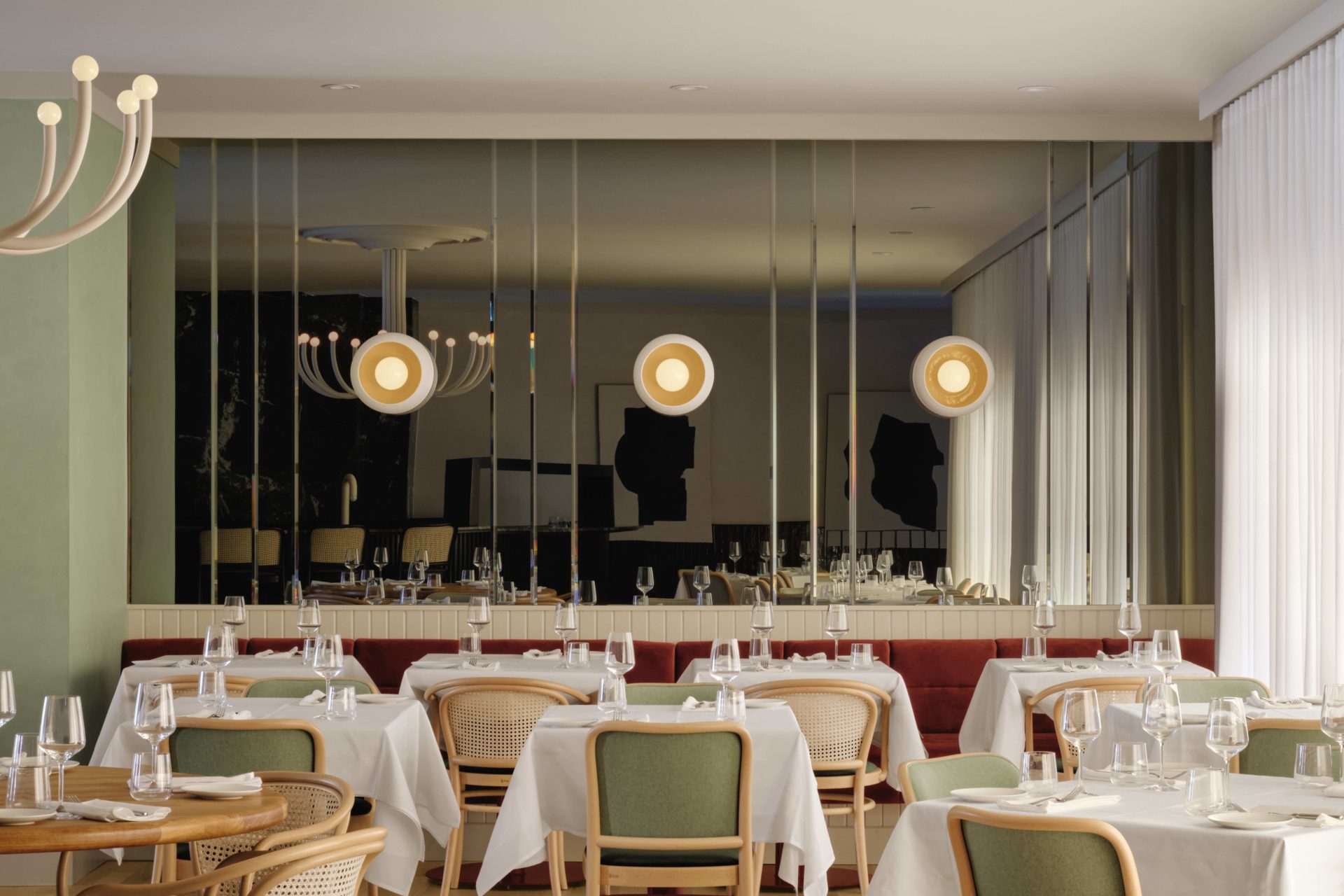 Dining area with mirrored back wall